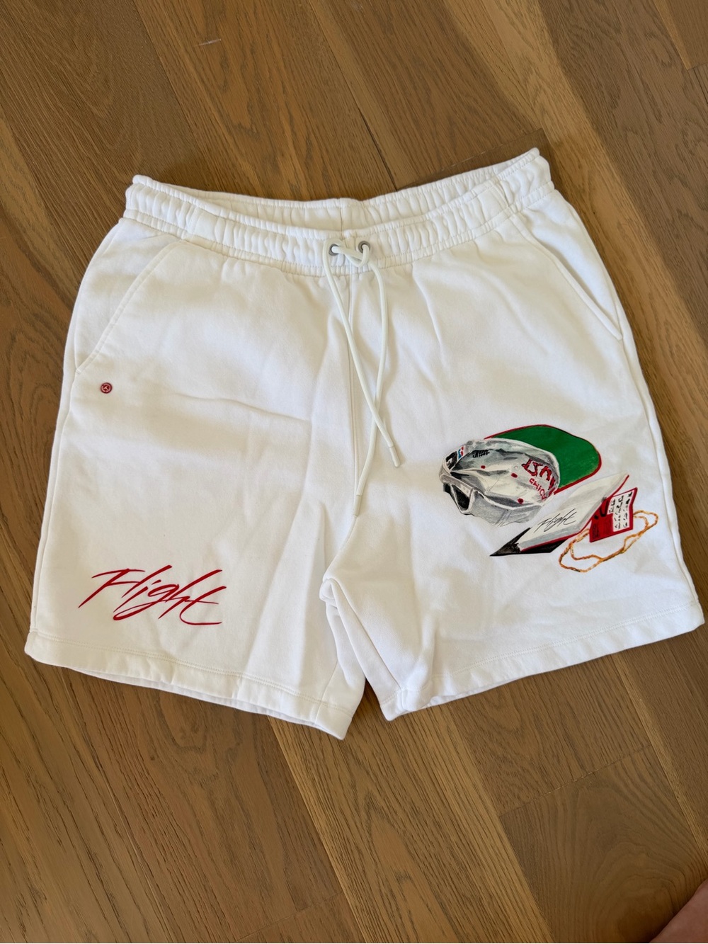 Jordan White Athletic Shorts with Red 'Flight' Script and Multicolor Graphic